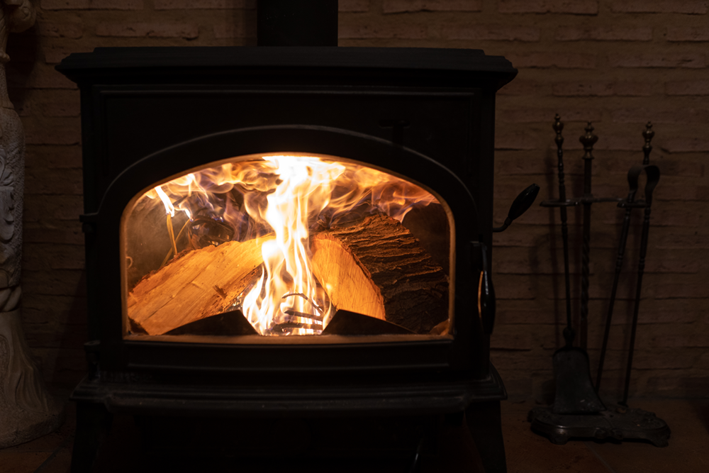 wood burning stove with fire burning
